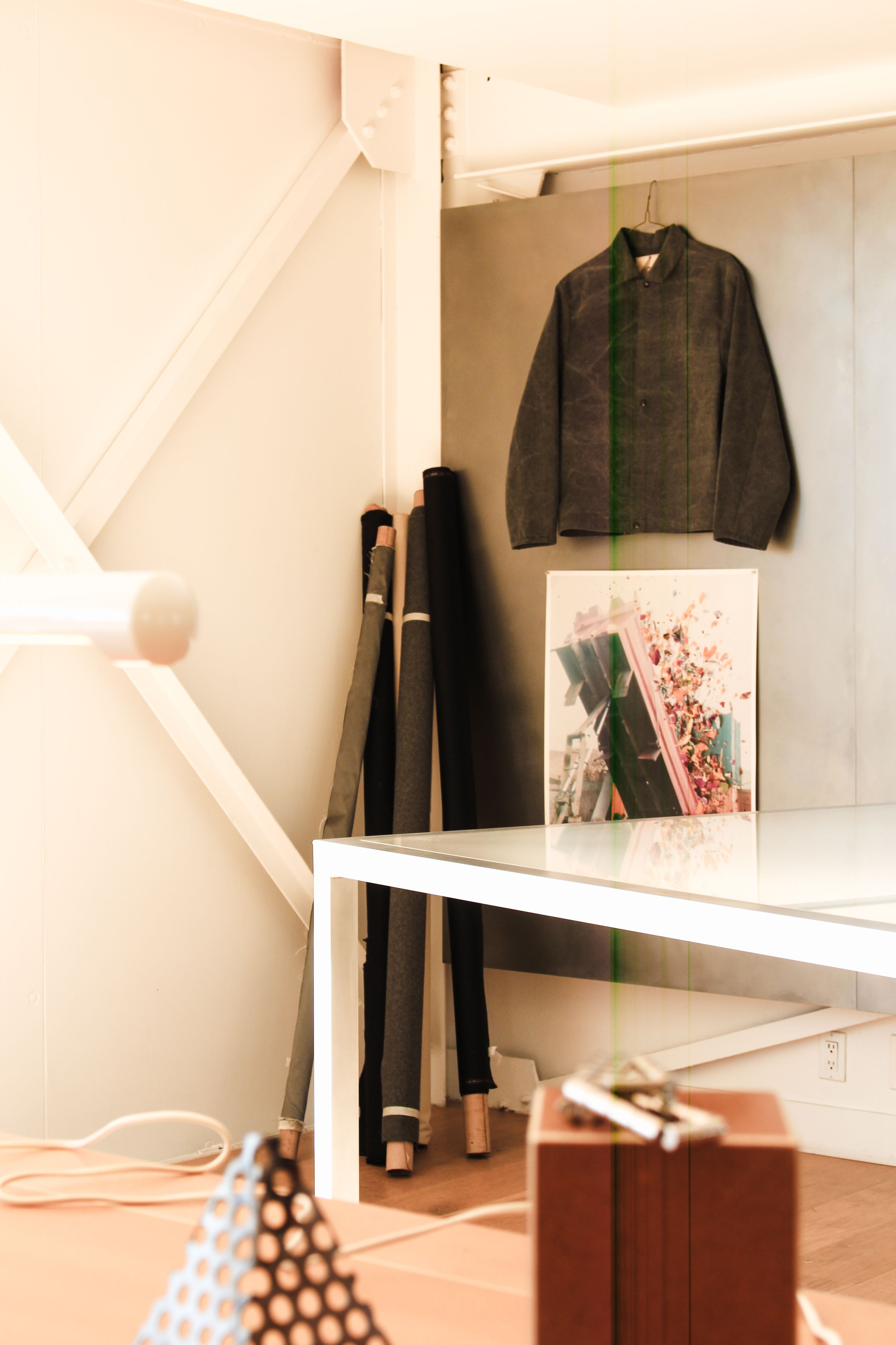 a jacket hanging on a stainless steel wall