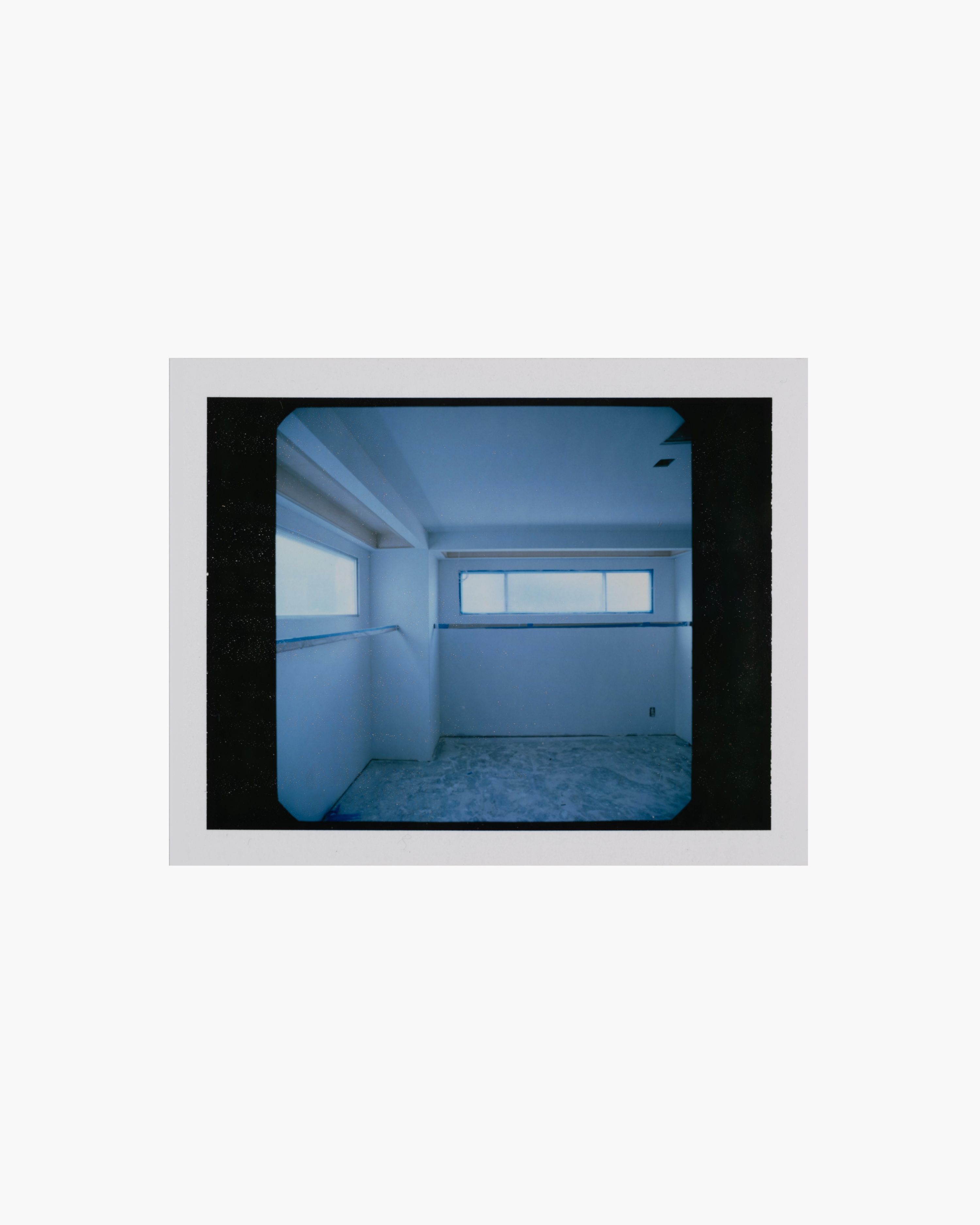 a polaroid image of an empty room under construction, WOE, Width Over Ears