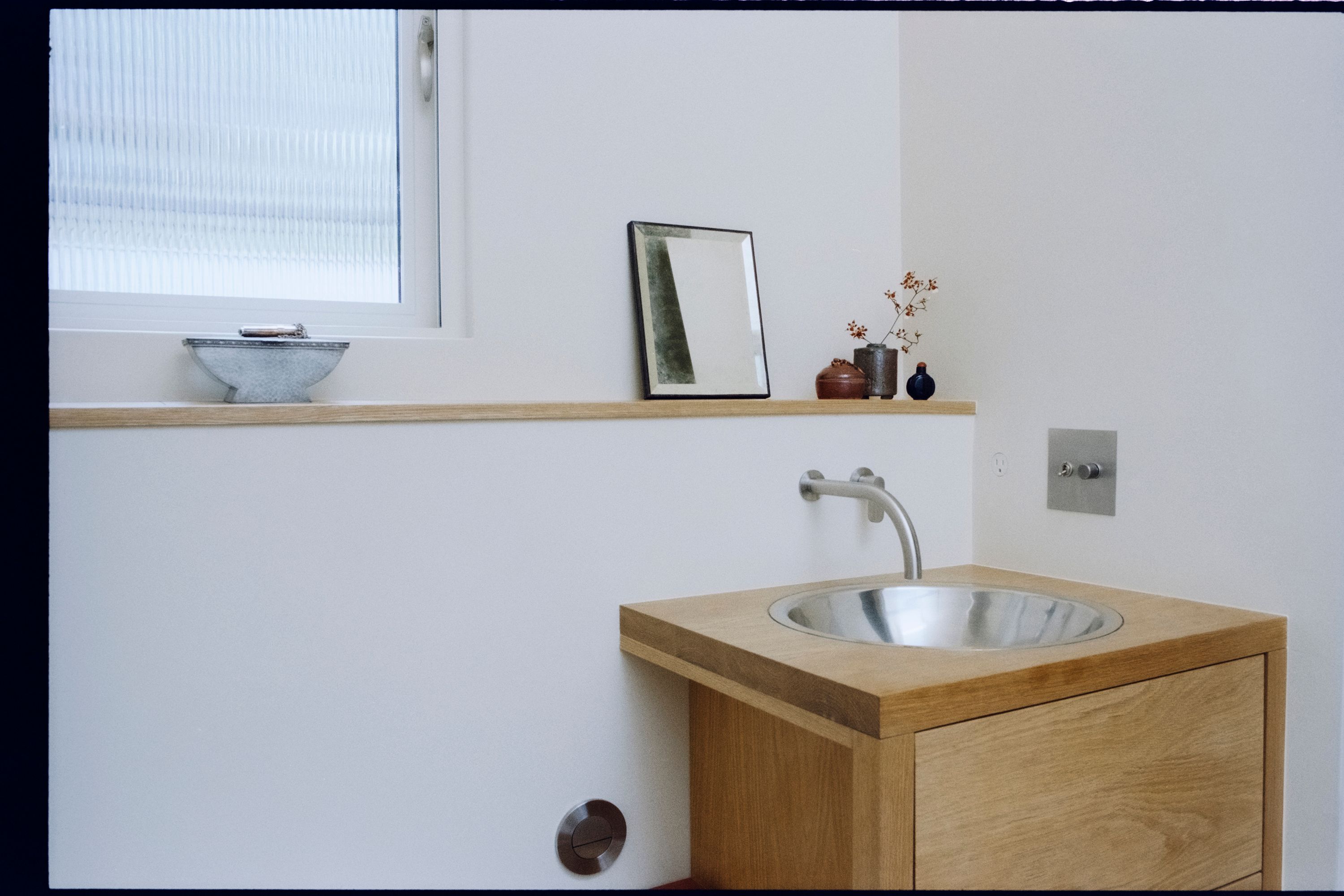 a wooden counter cabinet with stainless steel sink and plumbing, WOE, Width Over Ears