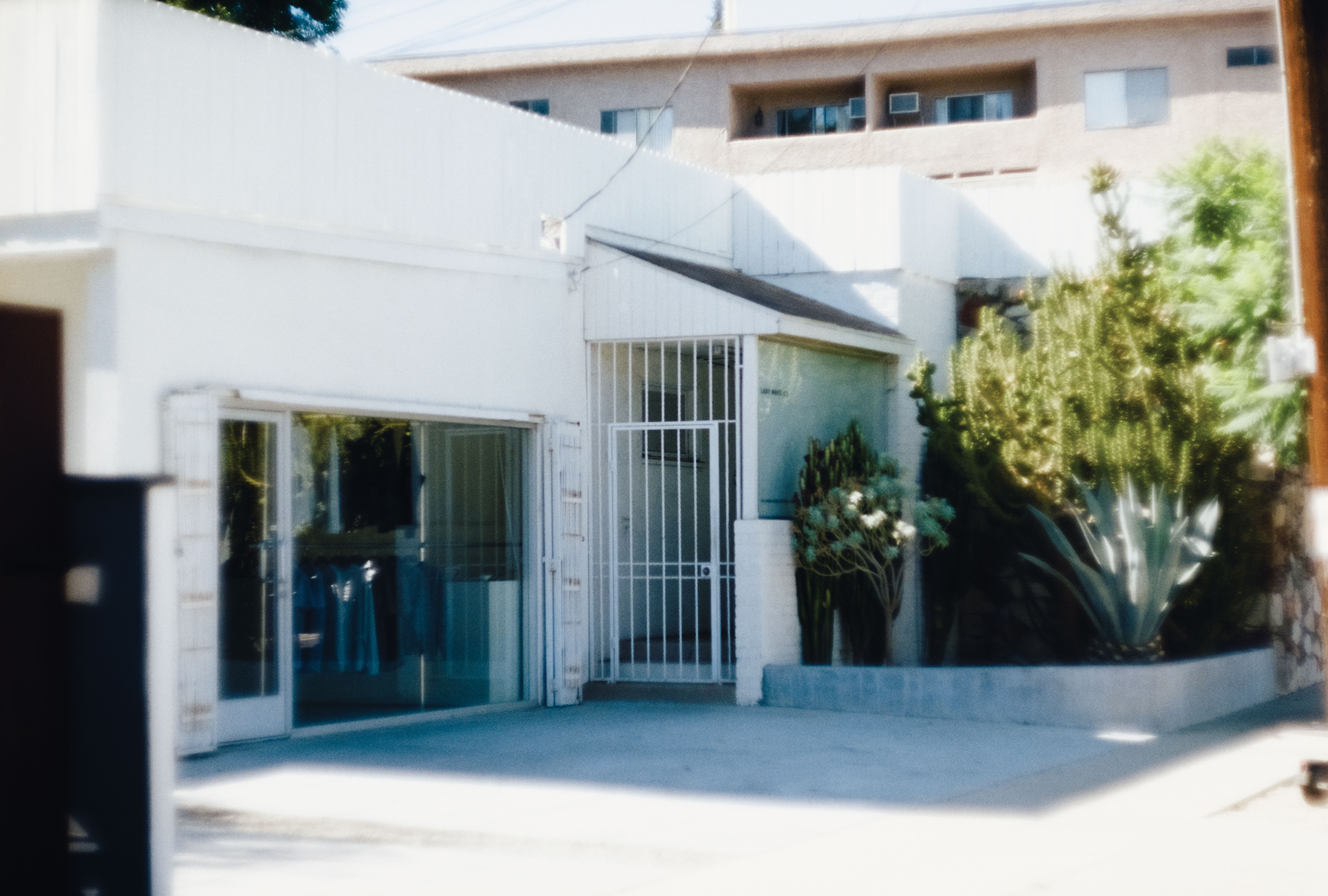 a white building with big windows, WOE, Width Over Ears