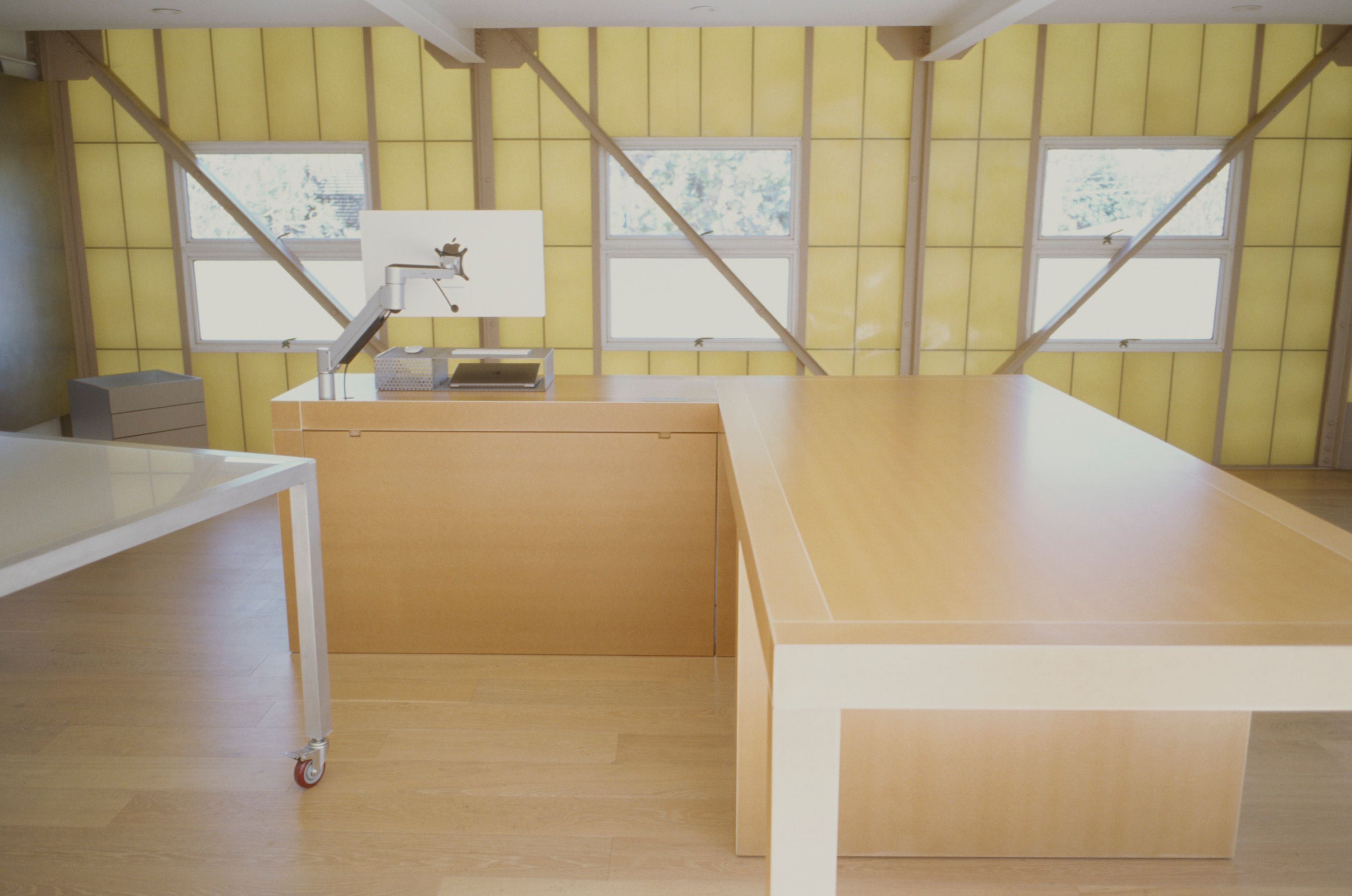 a large pair of tables in a room with fiberglass walls