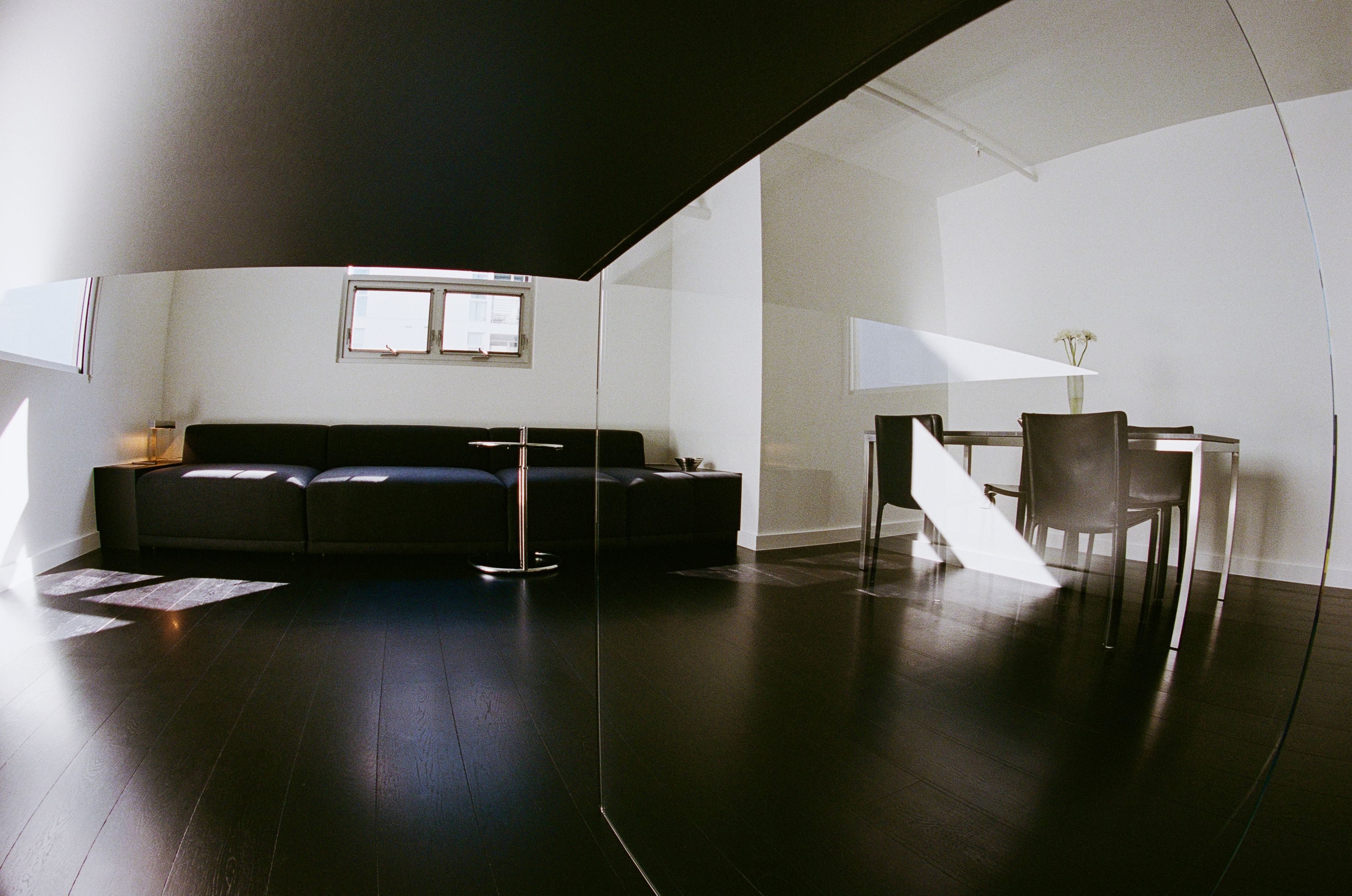 silver kitchen cabinetry with leather sink skirt