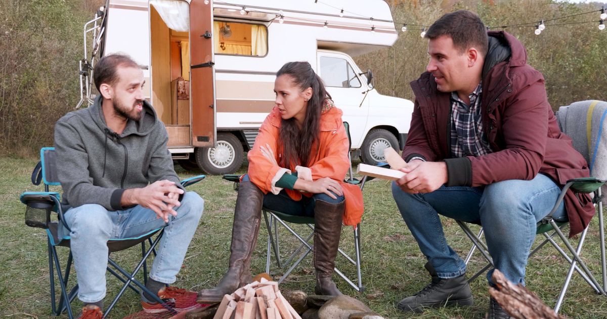 three people enjoying a stay in an RV Park using Reservation software