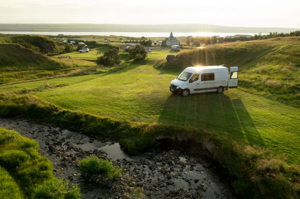 A white camper van in nature