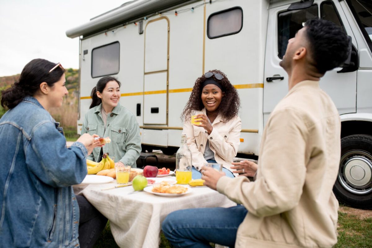 a group of friends enjoying their stay in a RV park thanks to campground management software
