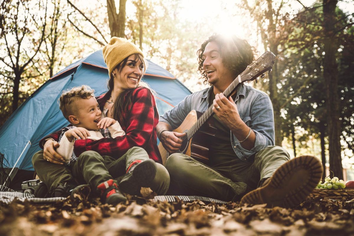 a family having a great camping experience in the forest 