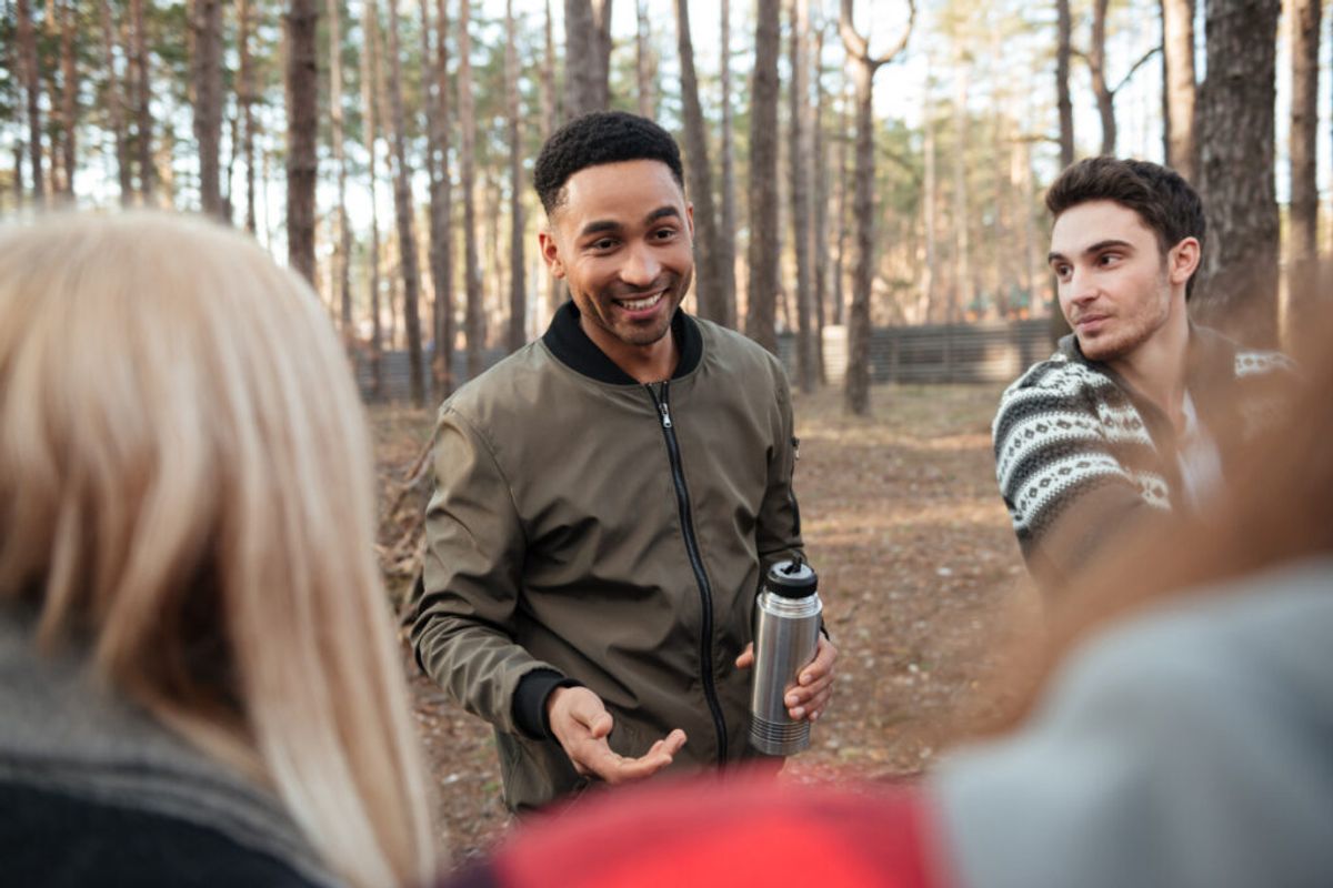 a member of a RV park staff explaining the day to the guests thanks to campground reservation software system 