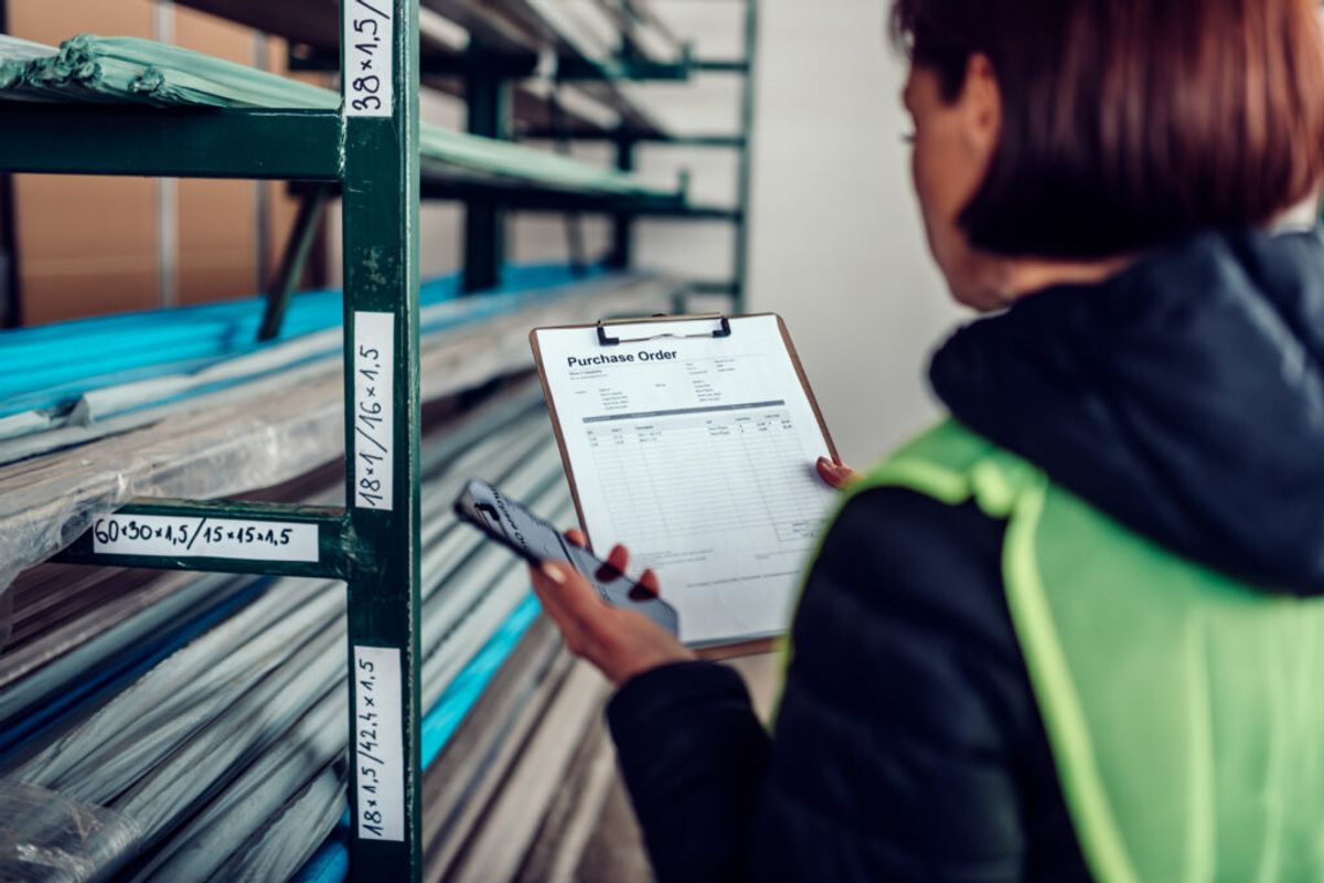 woman using a manual RV inventory management 