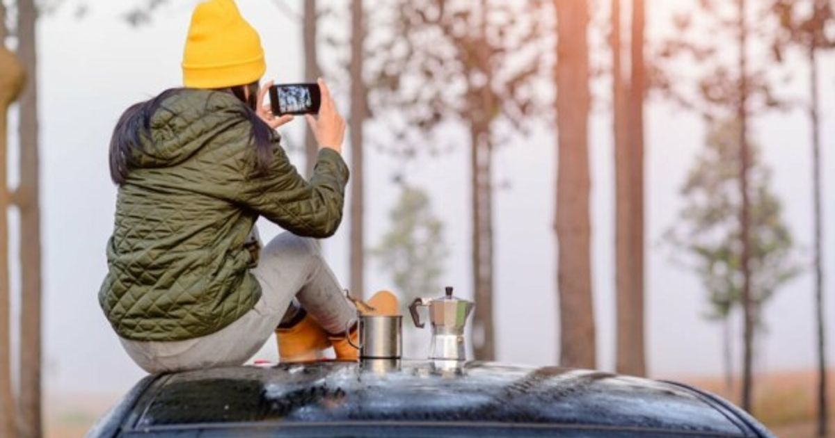 Traveler uploading photos of an RV park to social media