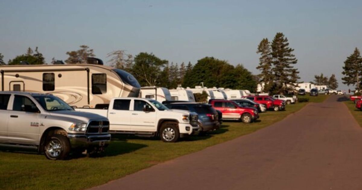 Cavendish, PEI- July 27, 2019: A line of trucks with RVs or winnebagos on a campground