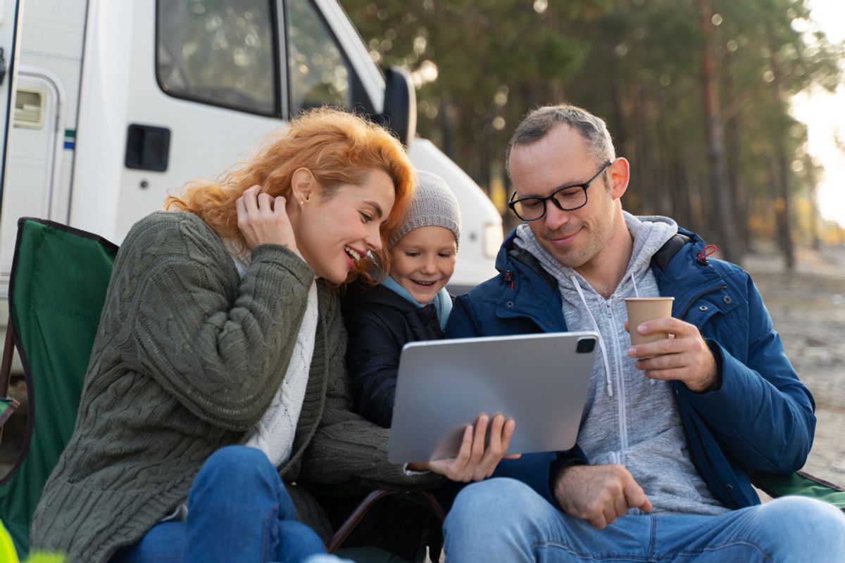 a family enojying the social media of their next RV park