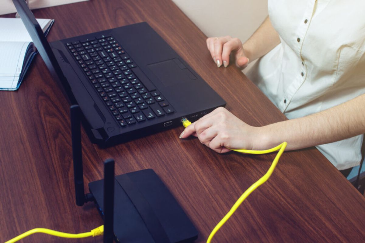 woman using a wired internet 