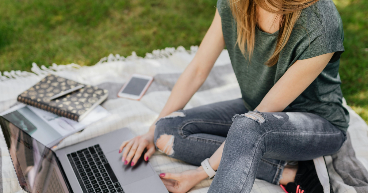 Woman with wifi on a campground