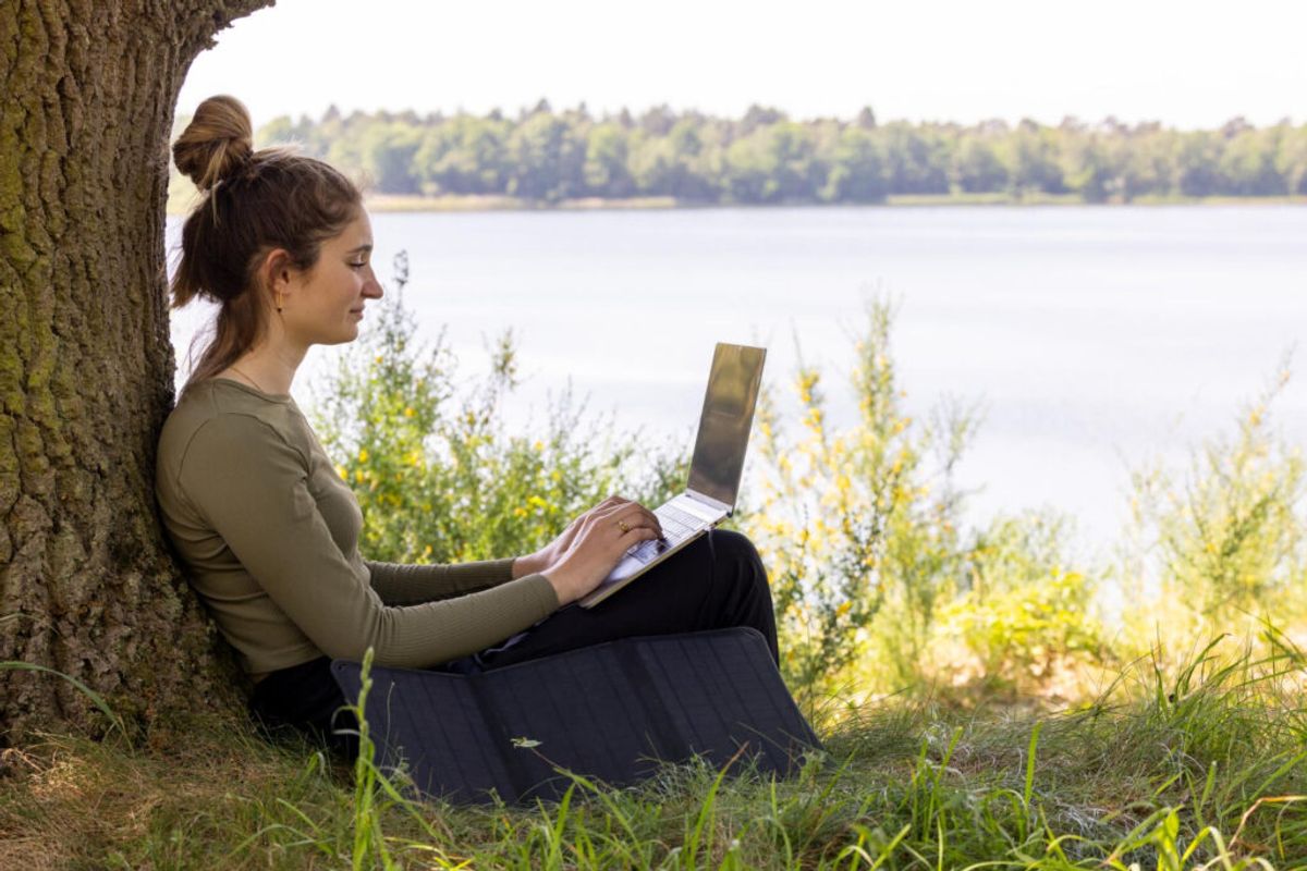 woman in the nature using campground internet 