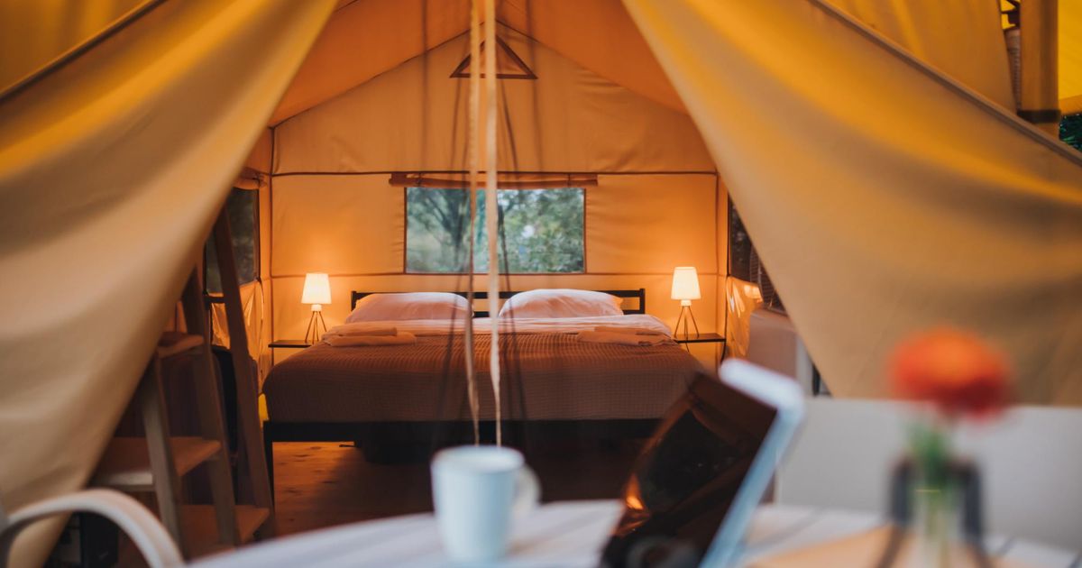 A focused view of a laptop outside of a glamping site