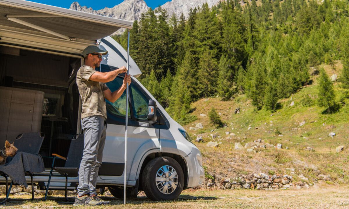 man adding the supplies he bought in a whosale for campers 