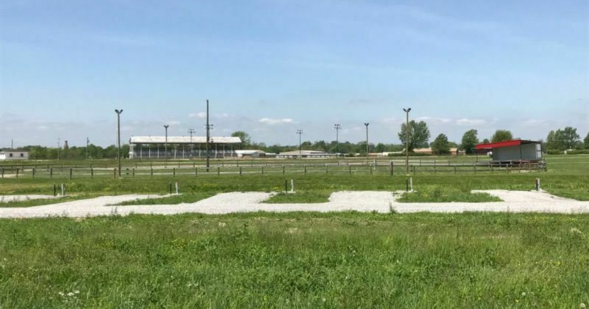 RV sites at The Marion Co. Fair RV Park, Lebanon, Kentucky, with the fairgrounds grandstand beyond