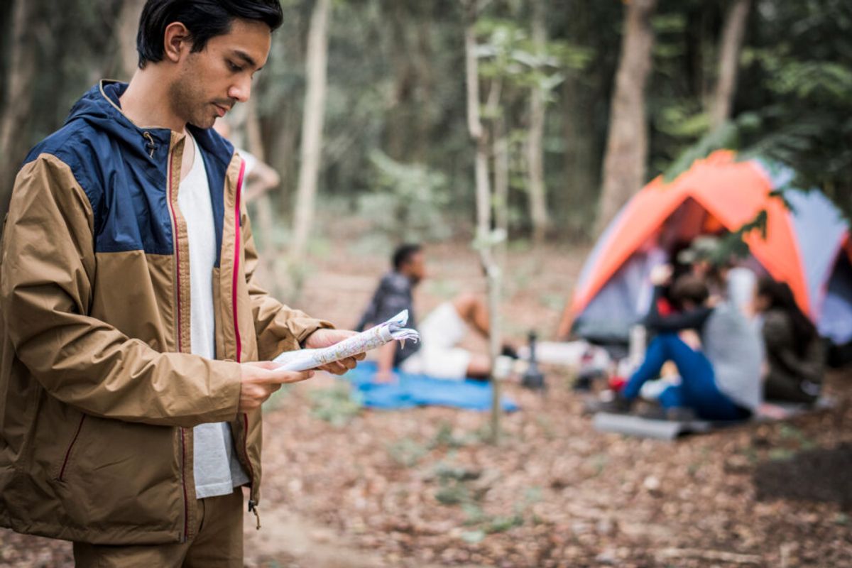 men looking at the permits to open a campground 