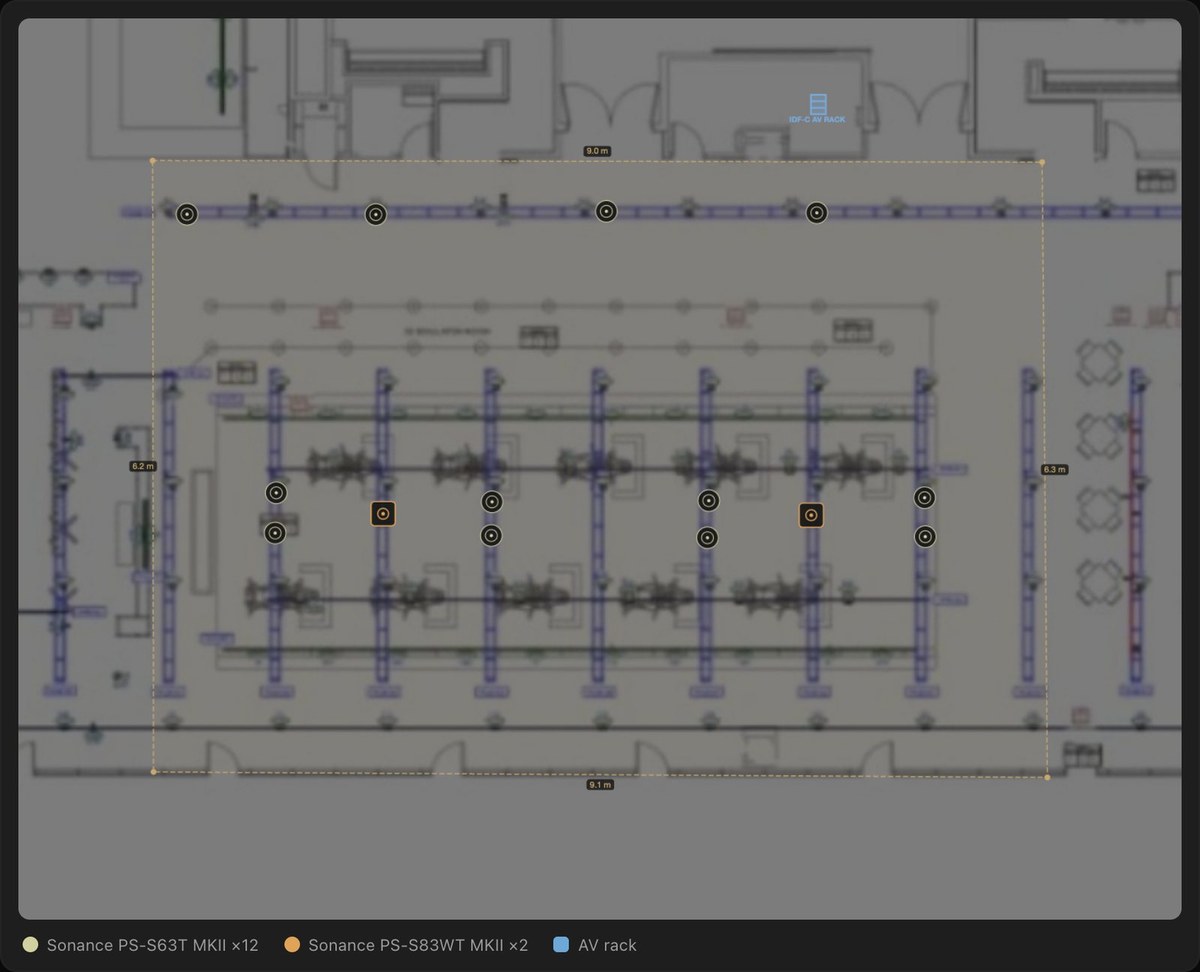 The simulator room's floor plan in the planner, traced over the venue's architectural drawing with the twelve pendants and two subwoofers placed