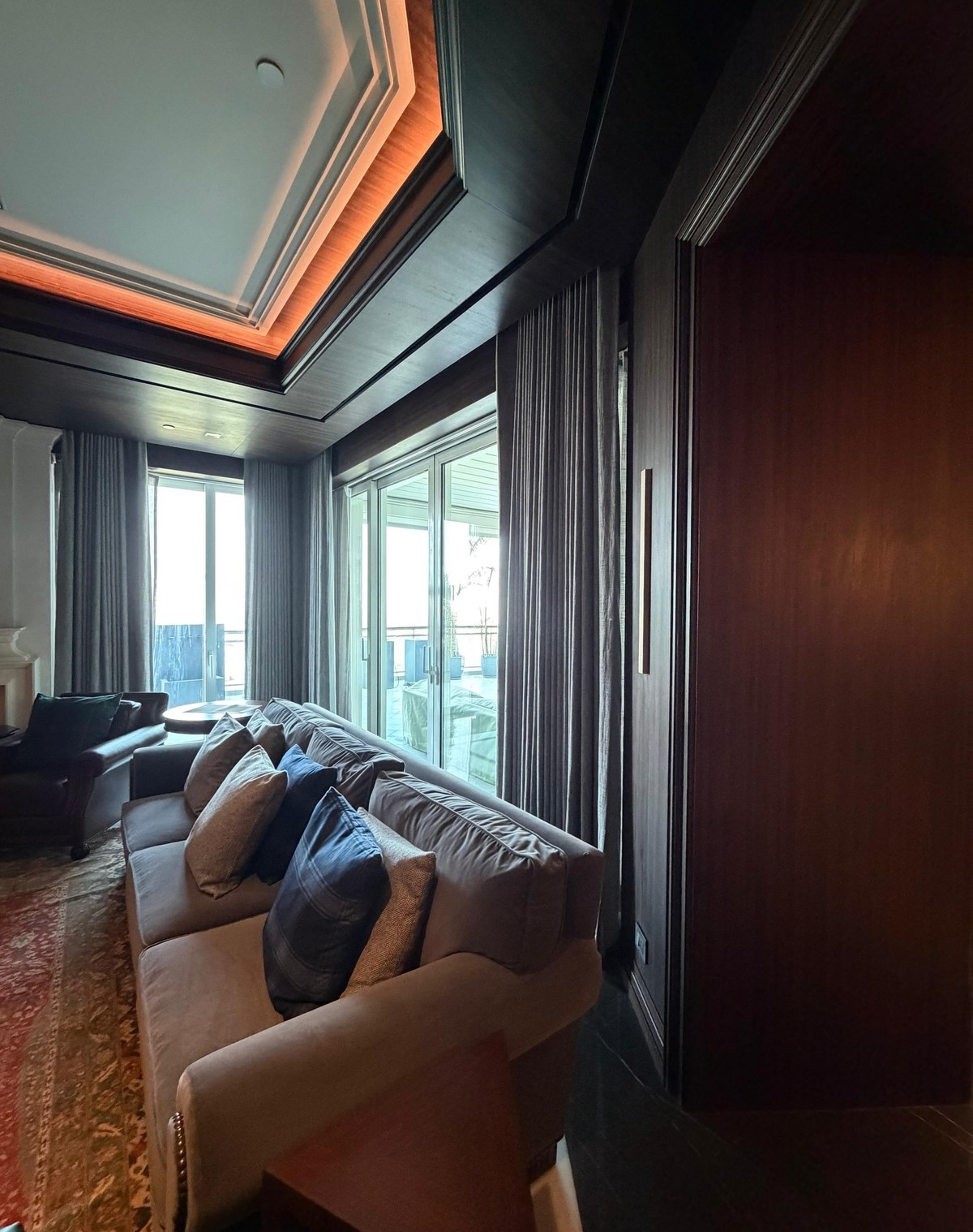 XSCACE QuadCane speaker flush-mounted into rich mahogany wood panelling in a formal dining room