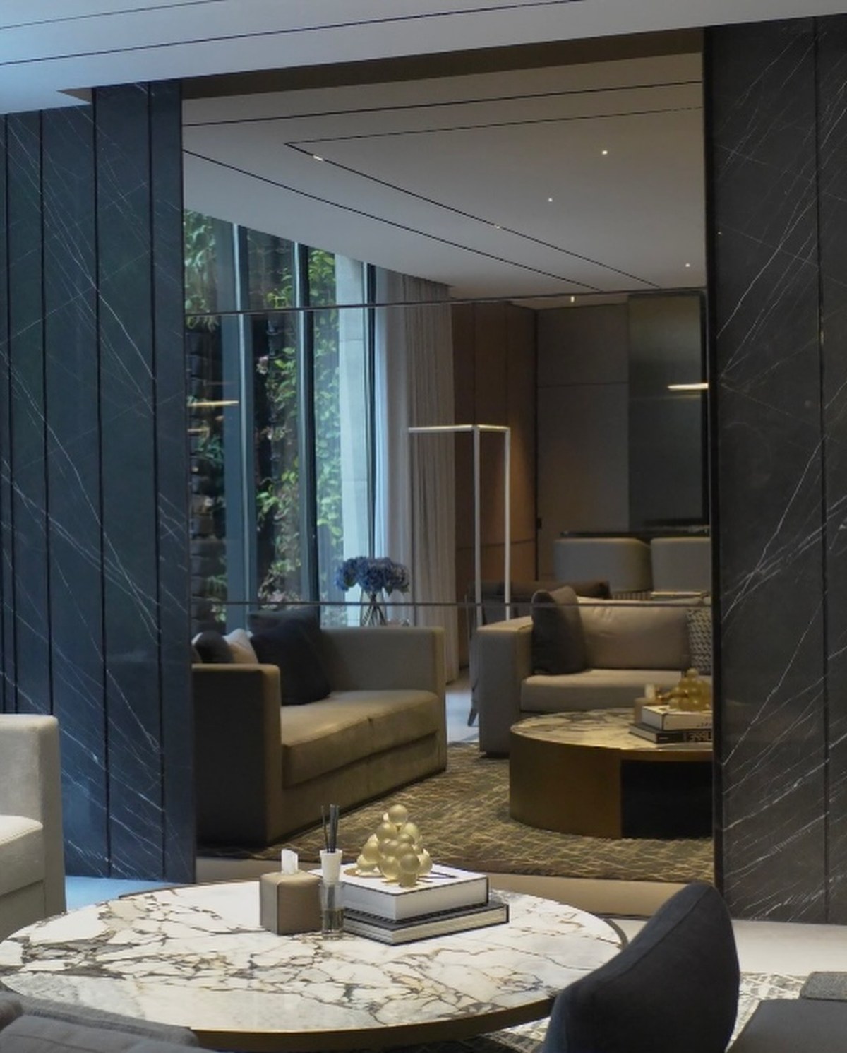 XSCACE Cedar speaker mounted on book-matched grey marble in a formal reception lounge