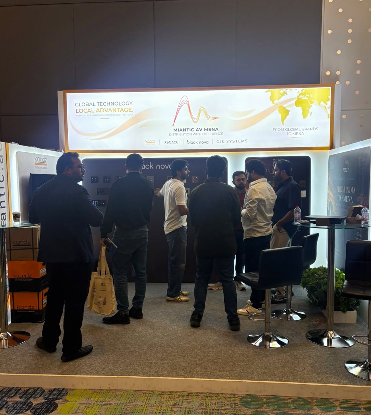 A group of visitors at the XSCACE stand at the High End and Smart Home Show 2026 in Dubai