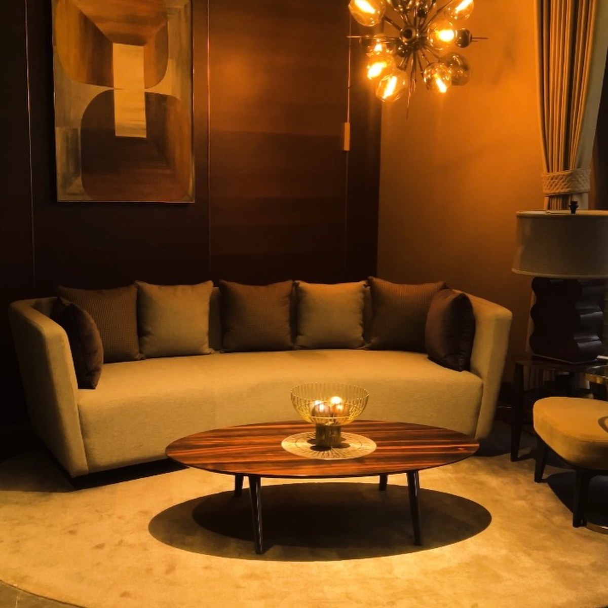 XSCACE Cane speaker in black finish on a charcoal stone accent wall in a formal sitting room