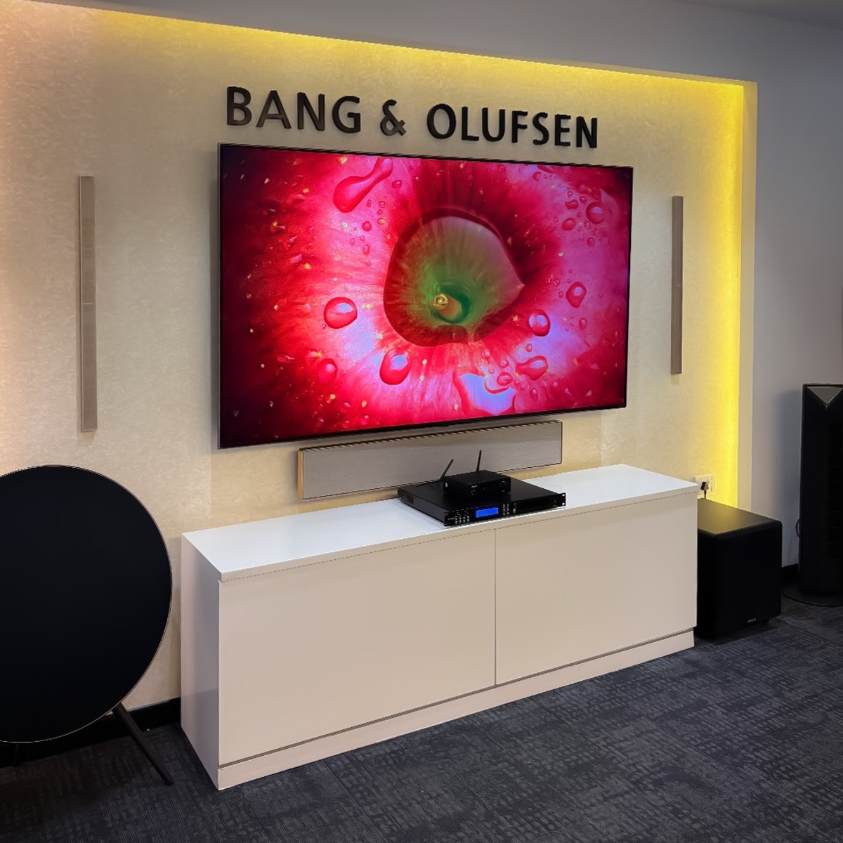 Wide view of the Bang & Olufsen showroom wall with XSCACE QuadCane speakers, subwoofer and reference systems