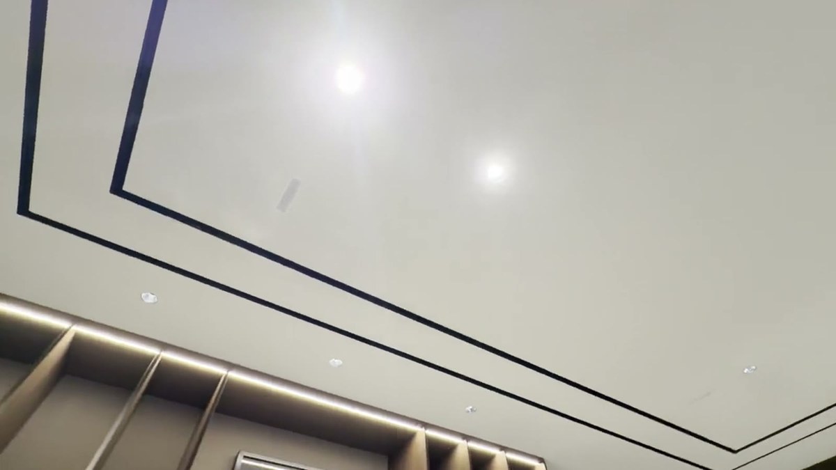 A pan across the media lounge ceiling and bookcase showing the flush-mounted Ghost 2.0 in-ceiling speakers