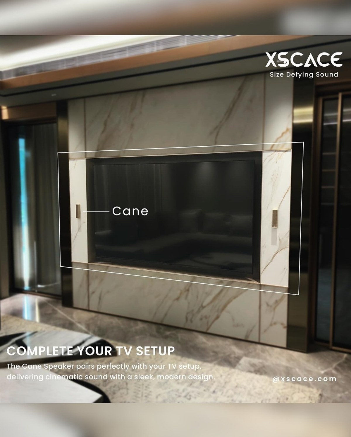 TV wall finished in marble paneling with an XSCACE Cane speaker mounted vertically beside the screen