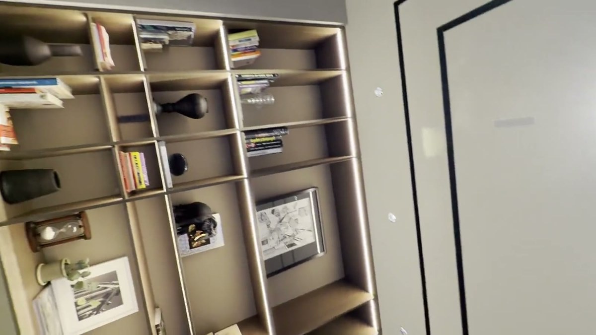 A pan across the media lounge ceiling and bookcase showing the flush-mounted Ghost 2.0 in-ceiling speakers