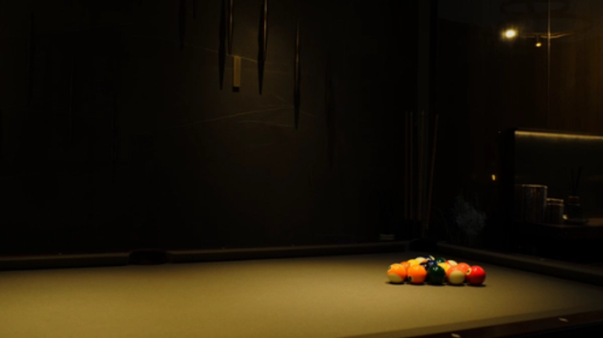 XSCACE Cane speaker in a dark luxury interior, wall-mounted beside ambient lighting