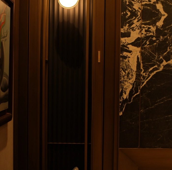 Case Study: Bonsai Beside a Bookmatched Marble Dressing Room Wall