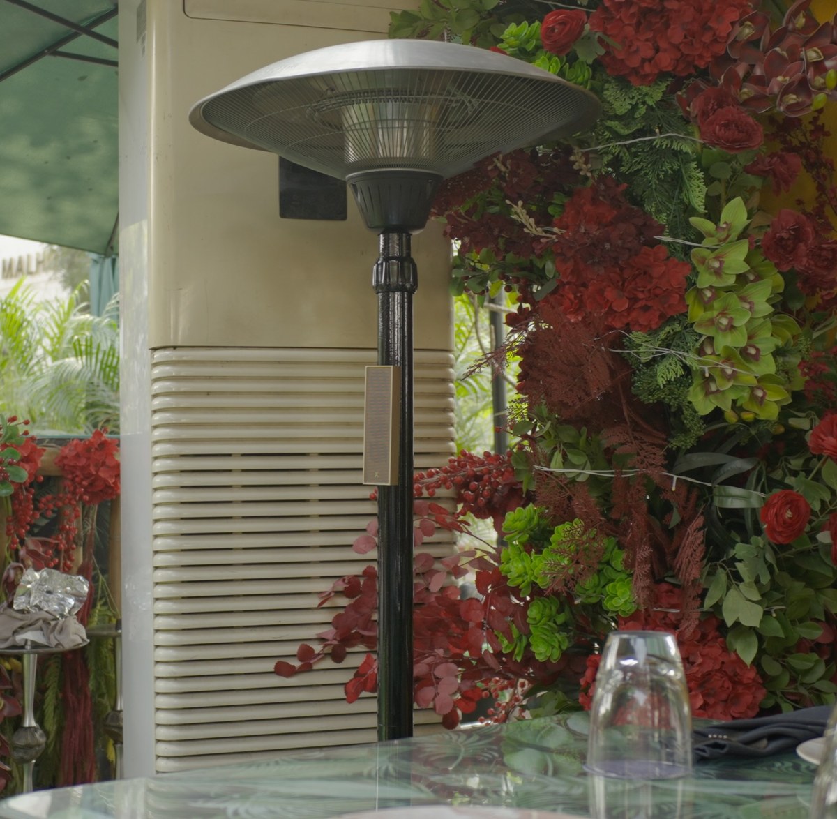 XSCACE Cane speaker flush-mounted on a mirrored mosaic-tile bar ceiling