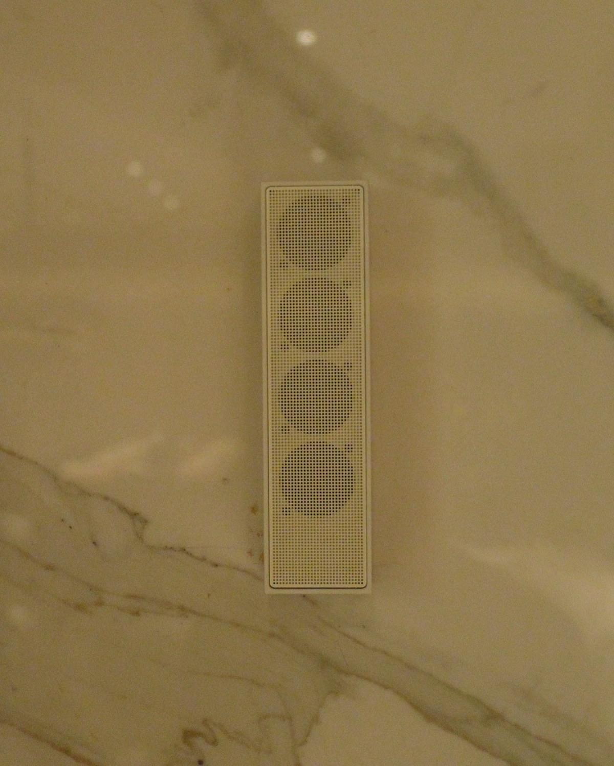XSCACE Cane speaker mounted on a woven fabric wall panel in a formal private dining room