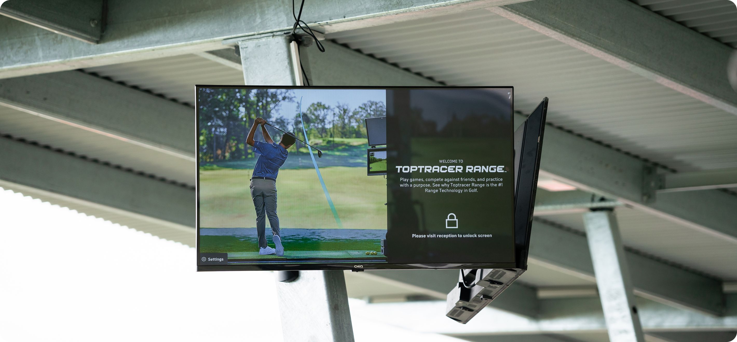 Man playing golf on a monitor