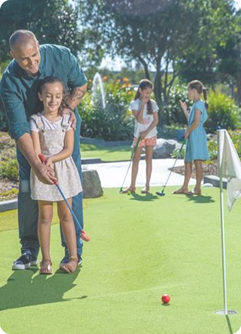 Man with Daughter Mini Golf