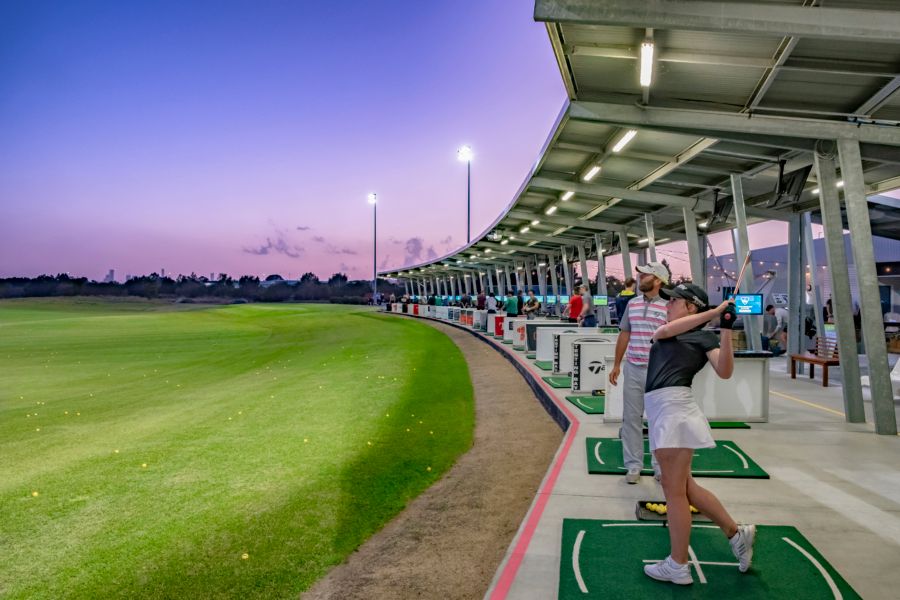 Kid swinging golf club