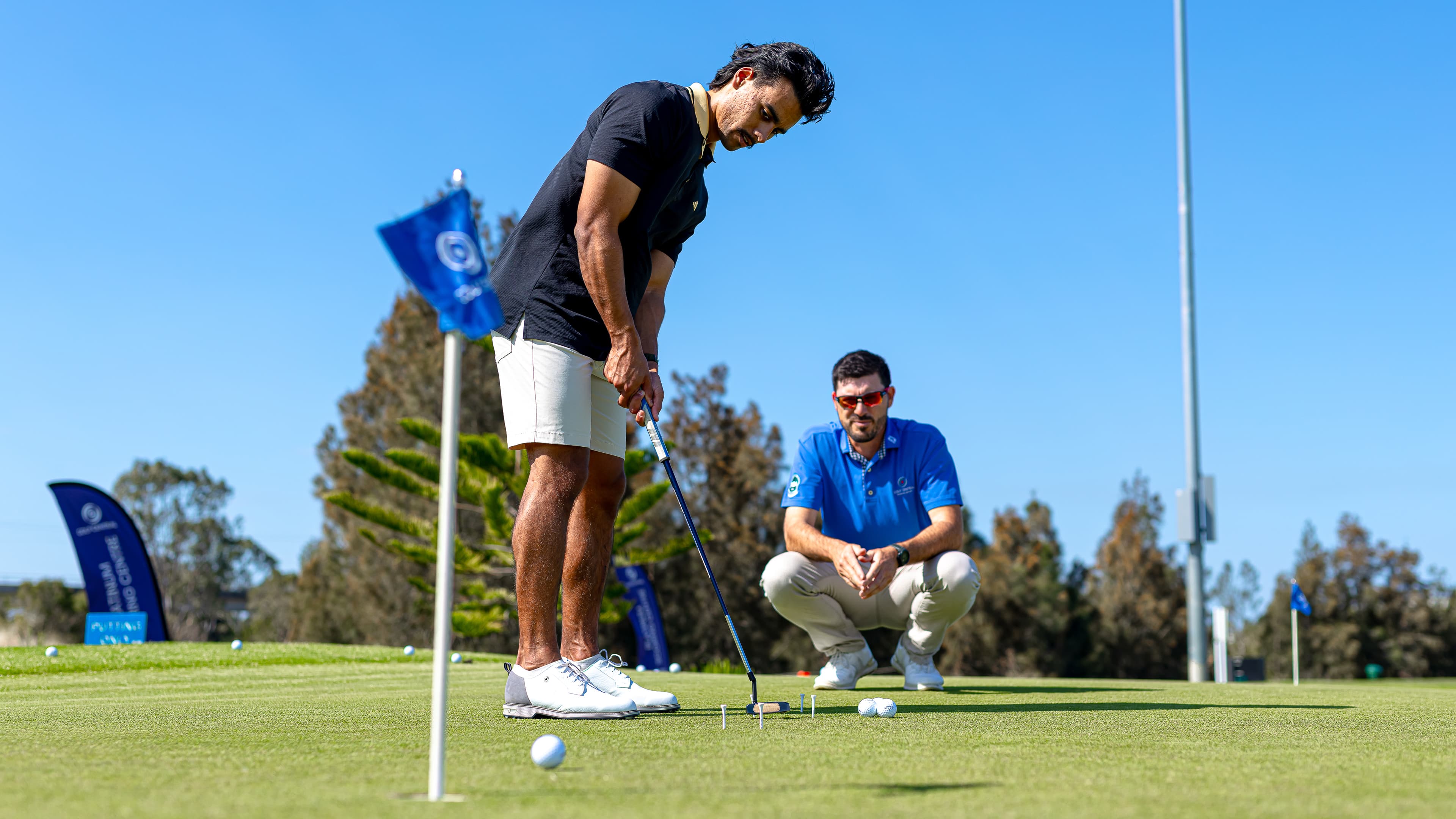 Man about to putt the ball