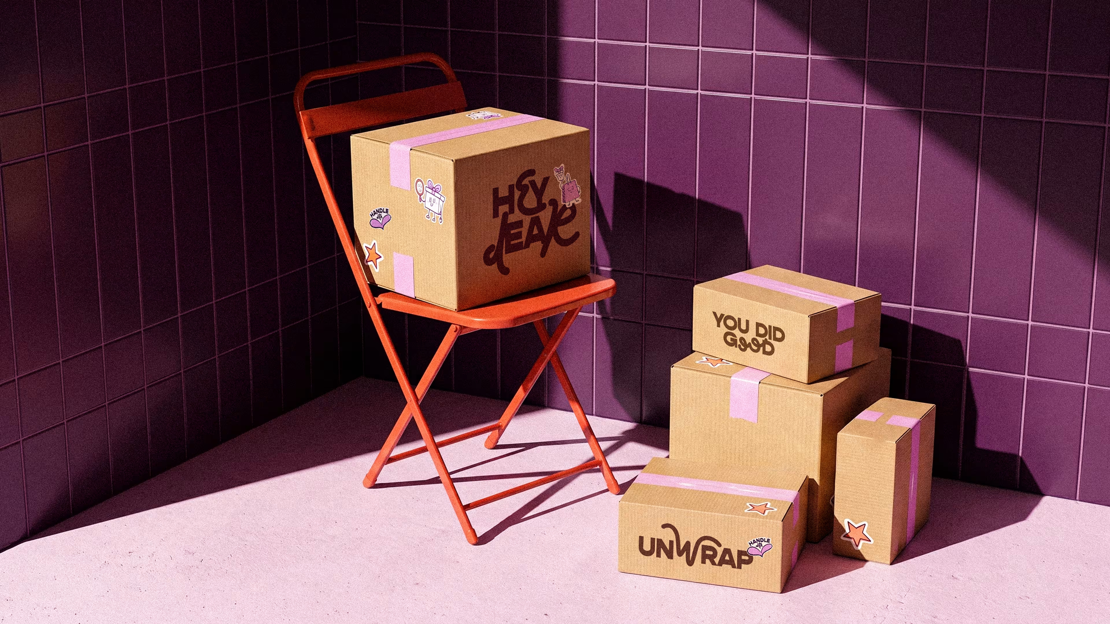 boxes with hey dear stickers in a minimal purple studio setting