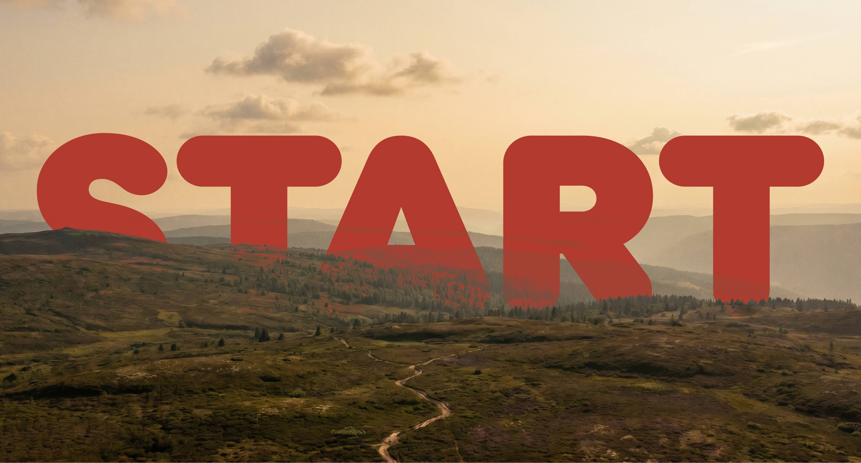 Large red "START" typography cropped across a hazy mountain valley at sunset.