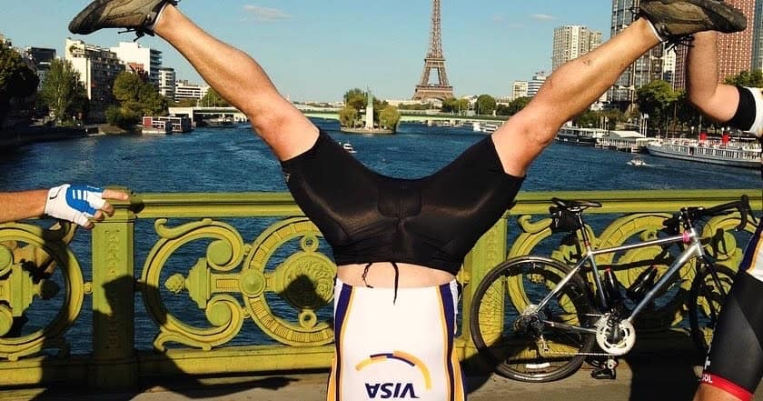 A rider celebrating at the Eiffel Tower finish