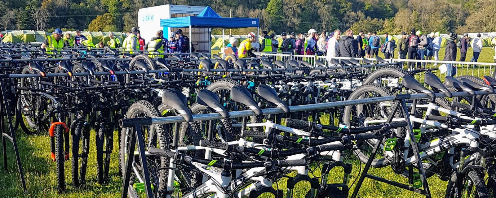 The support team and a field of bikes