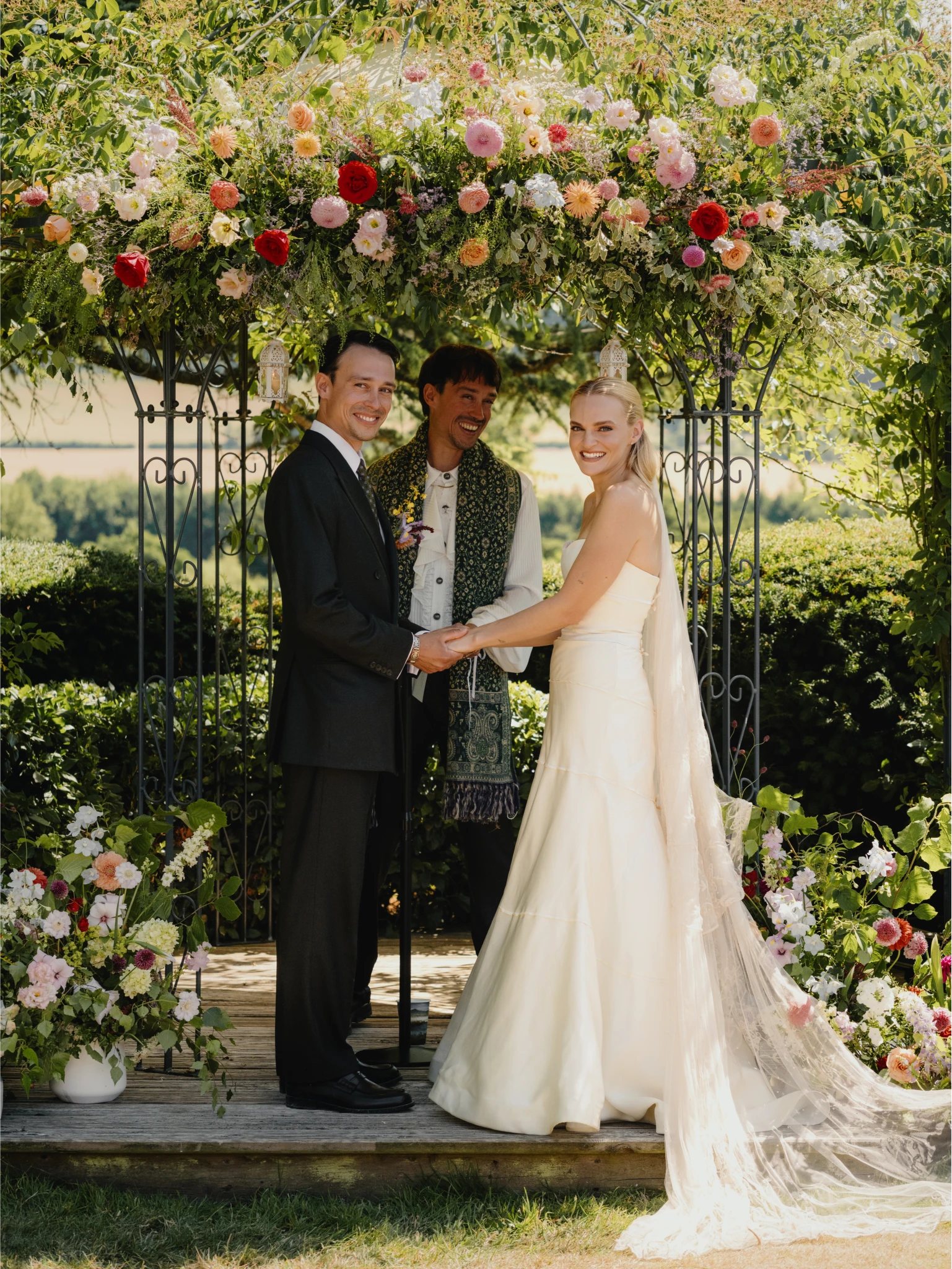 Jack & Maddie wedding alter under flowers