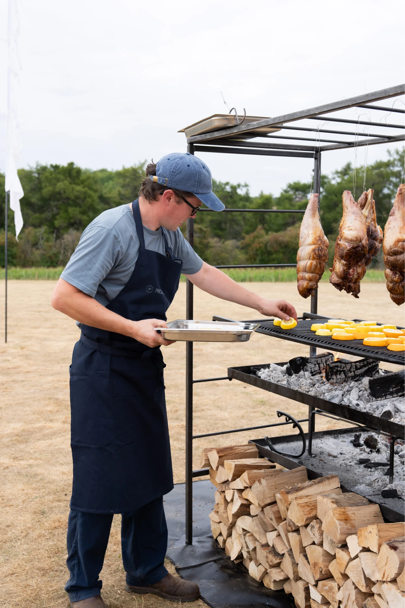 Phil, Lamb leg, orange & lemon slices on bbq