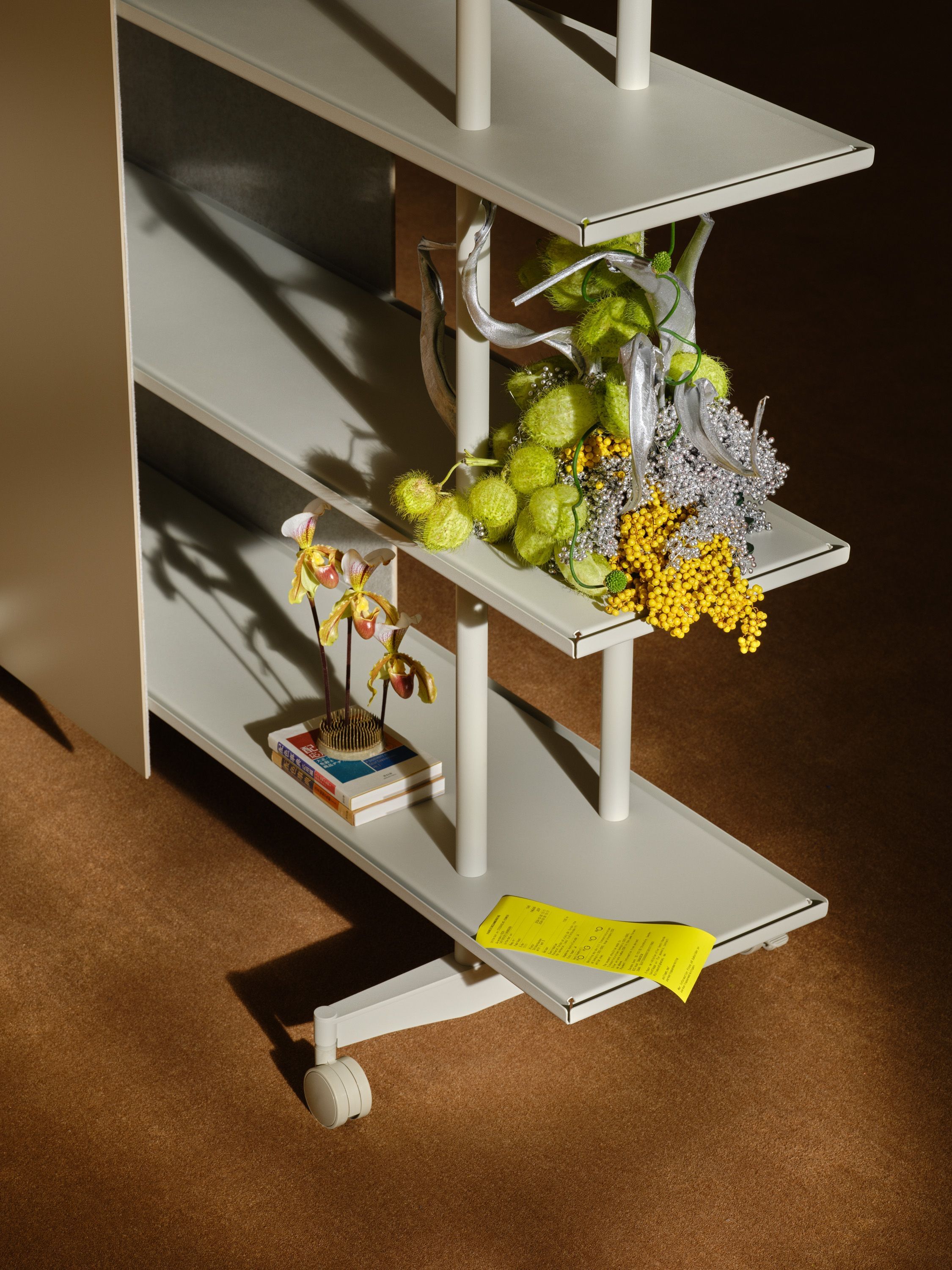 Close-up of an A08 shelf with grapes, mimosa and cut flowers
