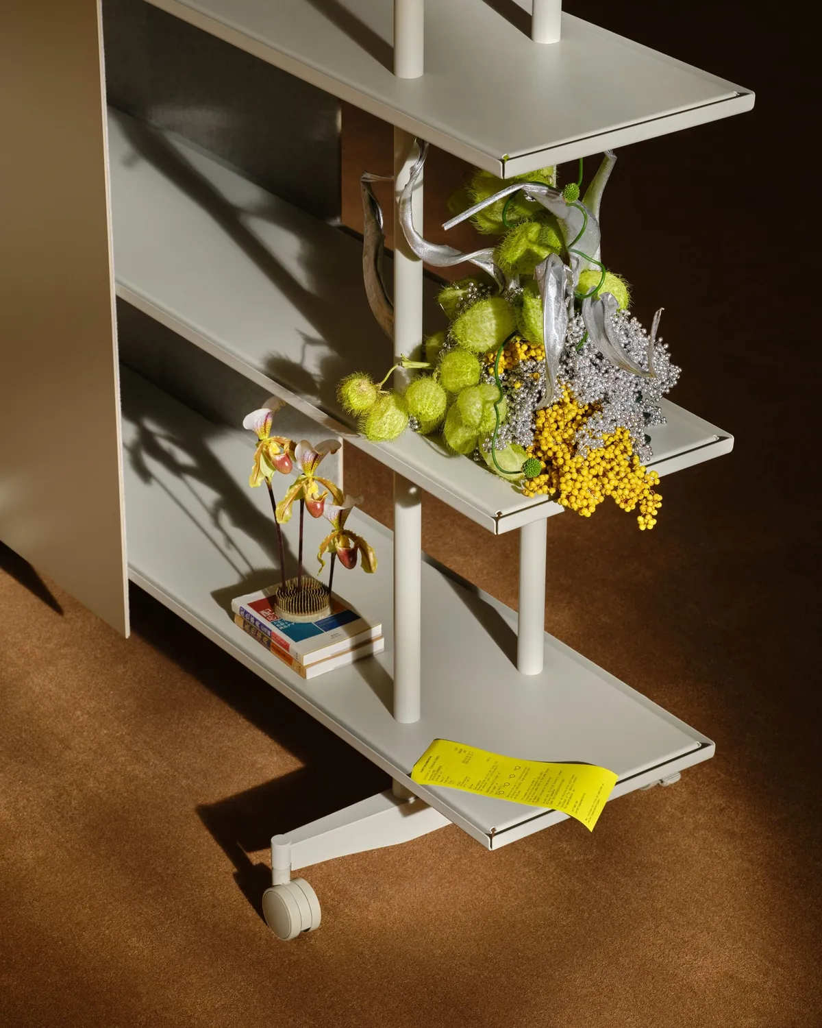 Close-up of an A08 shelf with grapes, mimosa and cut flowers