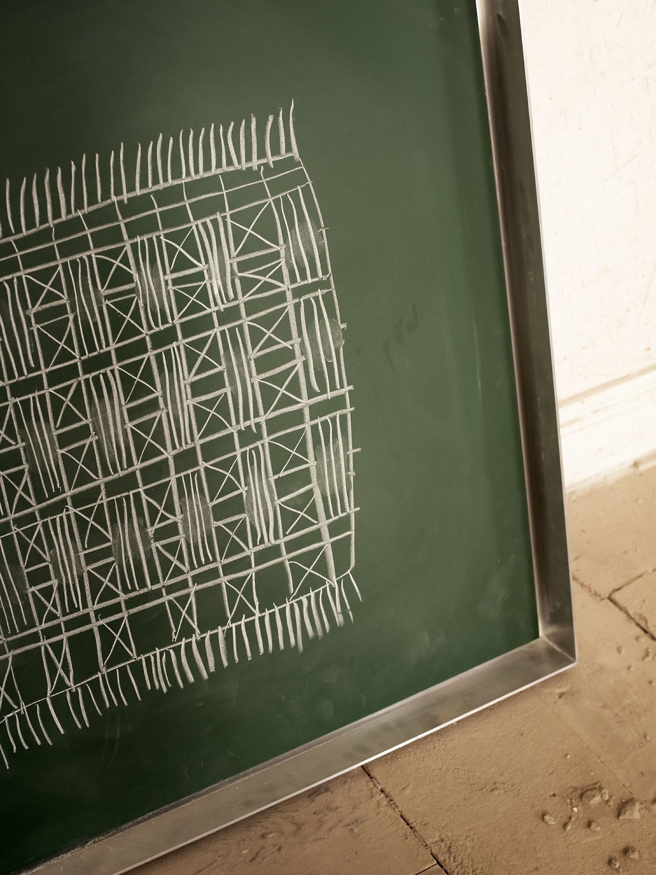 Chalk pattern drawn on a green board
