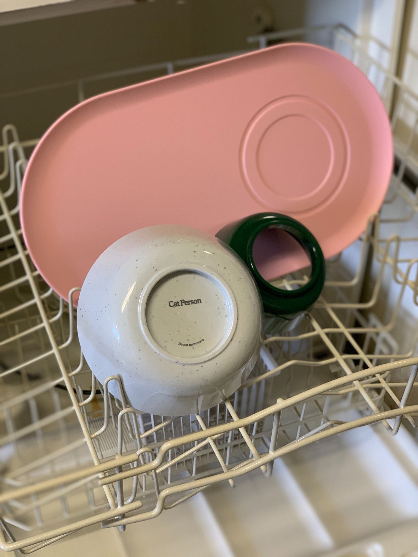 Cat Person Mesa Bowl components in the top rack of a dishwasher