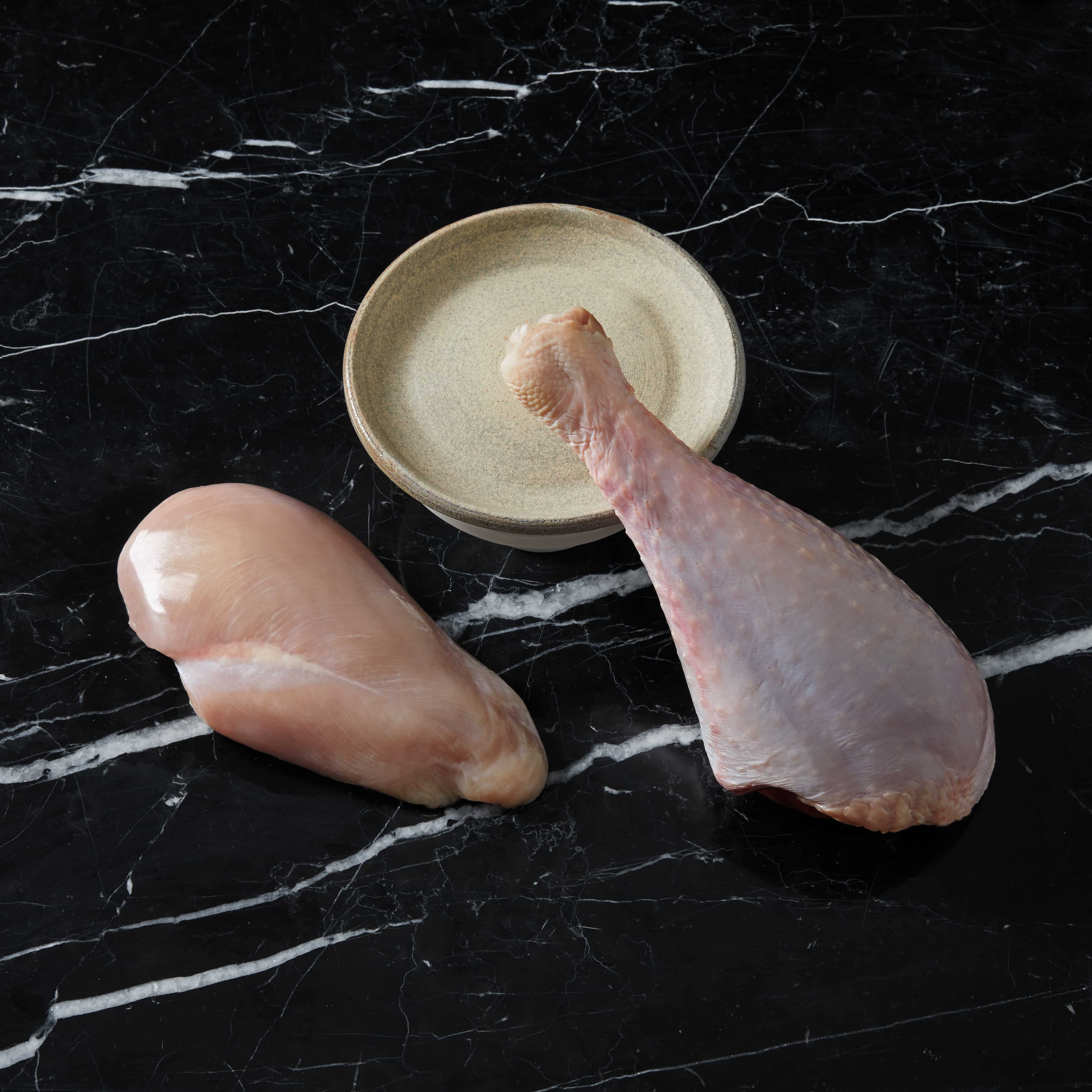Raw chicken breast and raw turkey leg